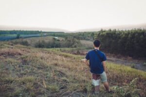 guy looking at his land
